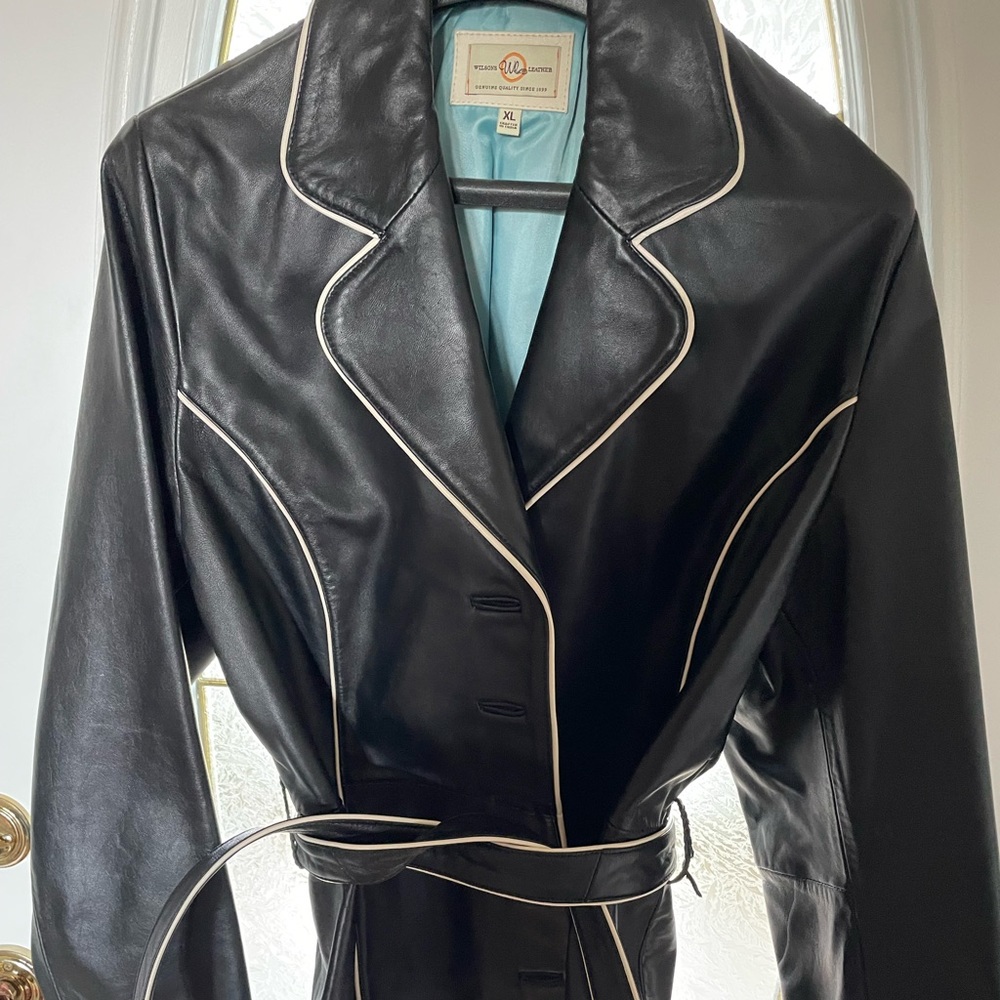 Wilson’s black leather with white trim jacket